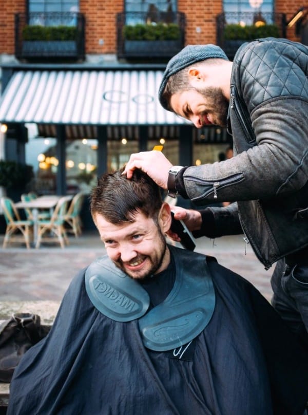 Barber gives haircuts to the homeless