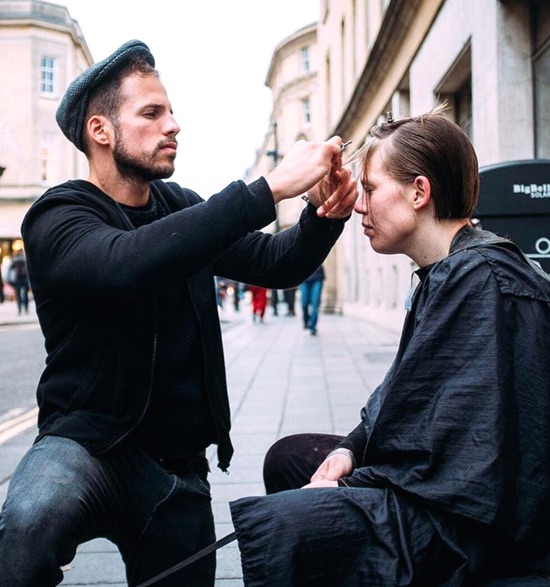 Barber gives haircuts to the homeless