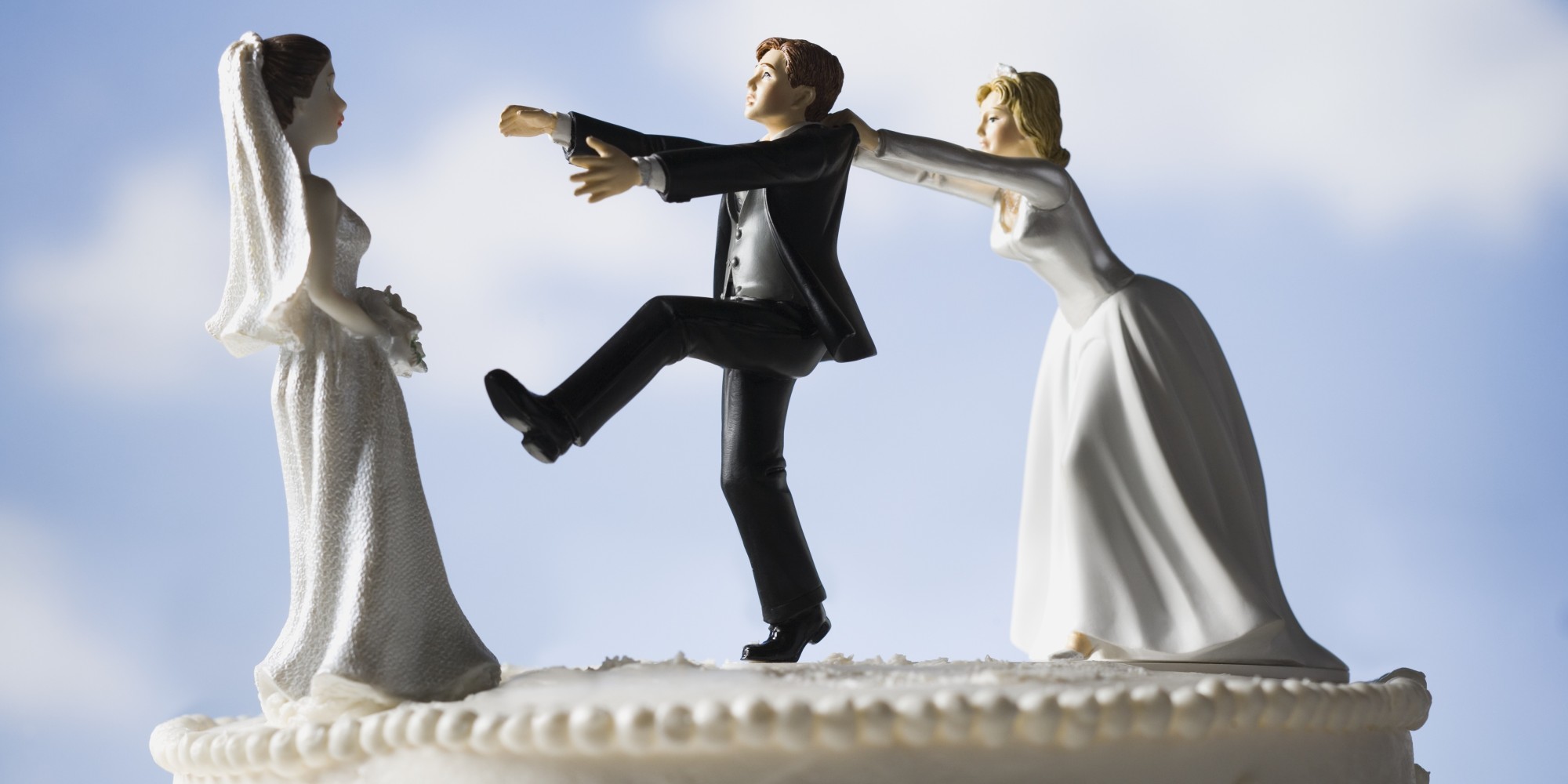 Wedding cake visual metaphor with figurine cake toppers