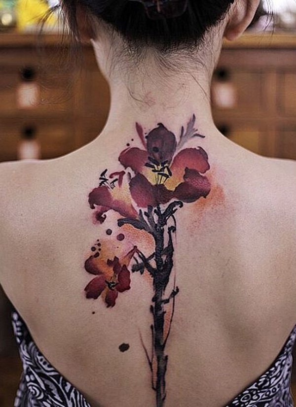 This beautiful flower tattoo is perfect for spine tattoo. The flowers themselves are placed in the upper back part so you can flaunt it easily with some type of clothes. The stems could then outline your spine.