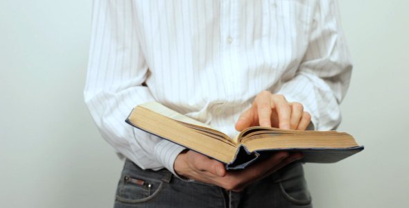 Man.Reading.a.Book.in.Hands