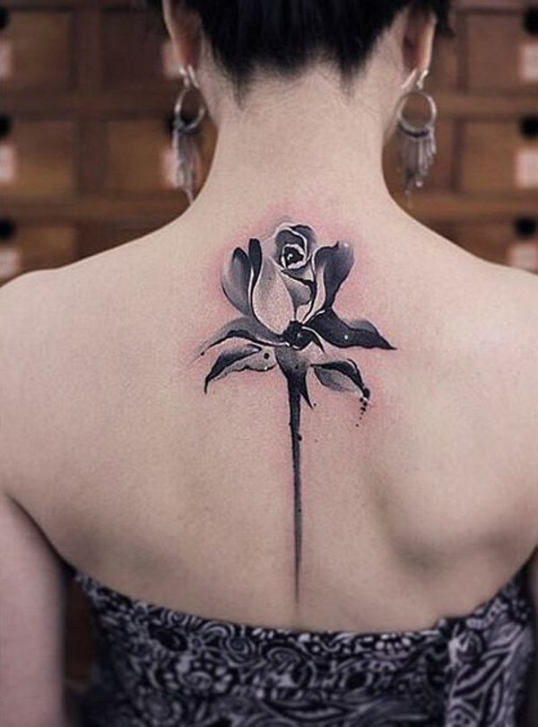 Another rose spin tattoo but this one is much subtler and smaller.