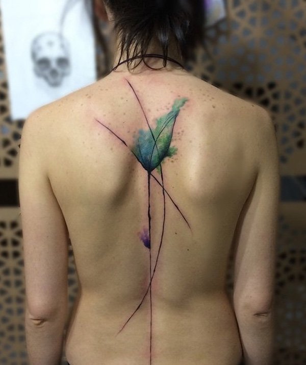Another watercolor inspired spine tattoo. This one looks rather like a flower. The best thing about watercolor inspired tattoos are the splash of bright and pastel colors. It’s actually a hard style so find a good tattoo artist.