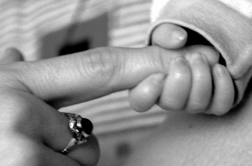 child-holding-hand