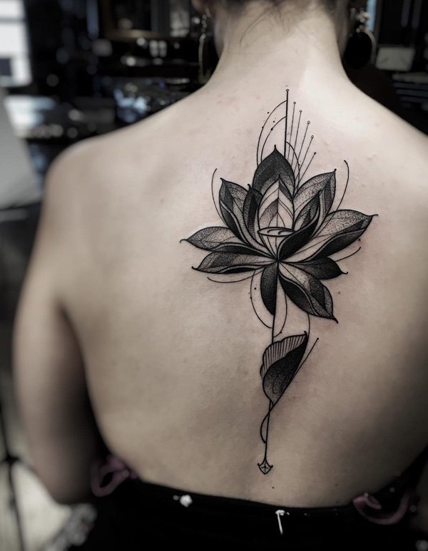 An abstract style lotus tattoo for a more unique design. A lotus flower has different meanings depending on its color but in general, it is associated with spiritual purity and enlightenment.