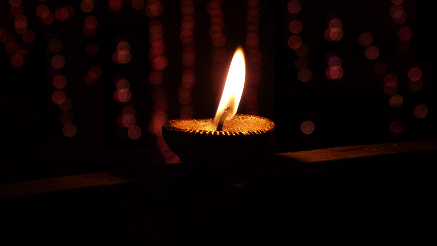 Lighting Diya and other oil lamp creates its own positive field of Energy