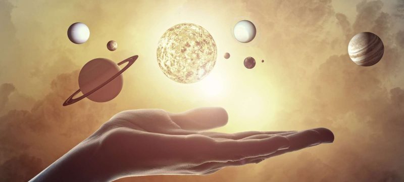 Close up of planet sun system in your hand